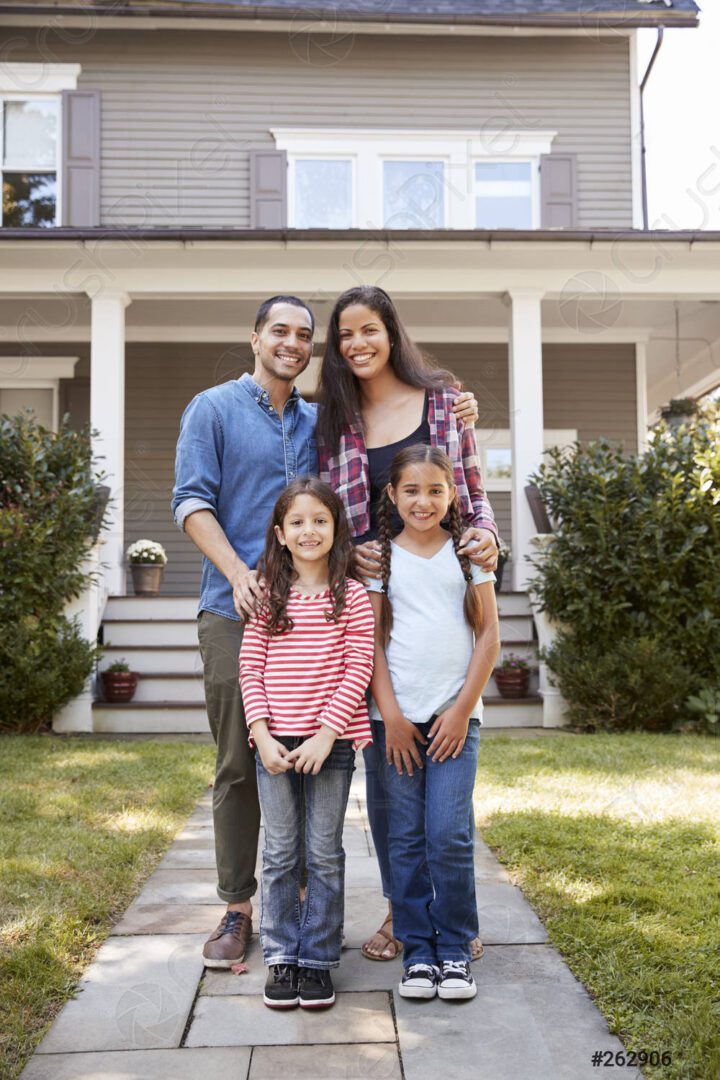 portrait-smiling-family-standing-front-262906